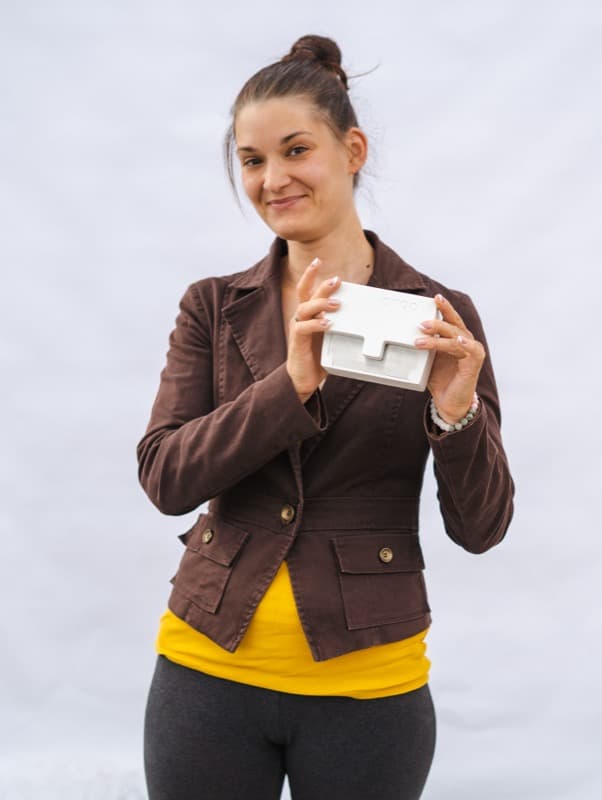 Veterinarian holding Ongo Vision portable semen analyzer